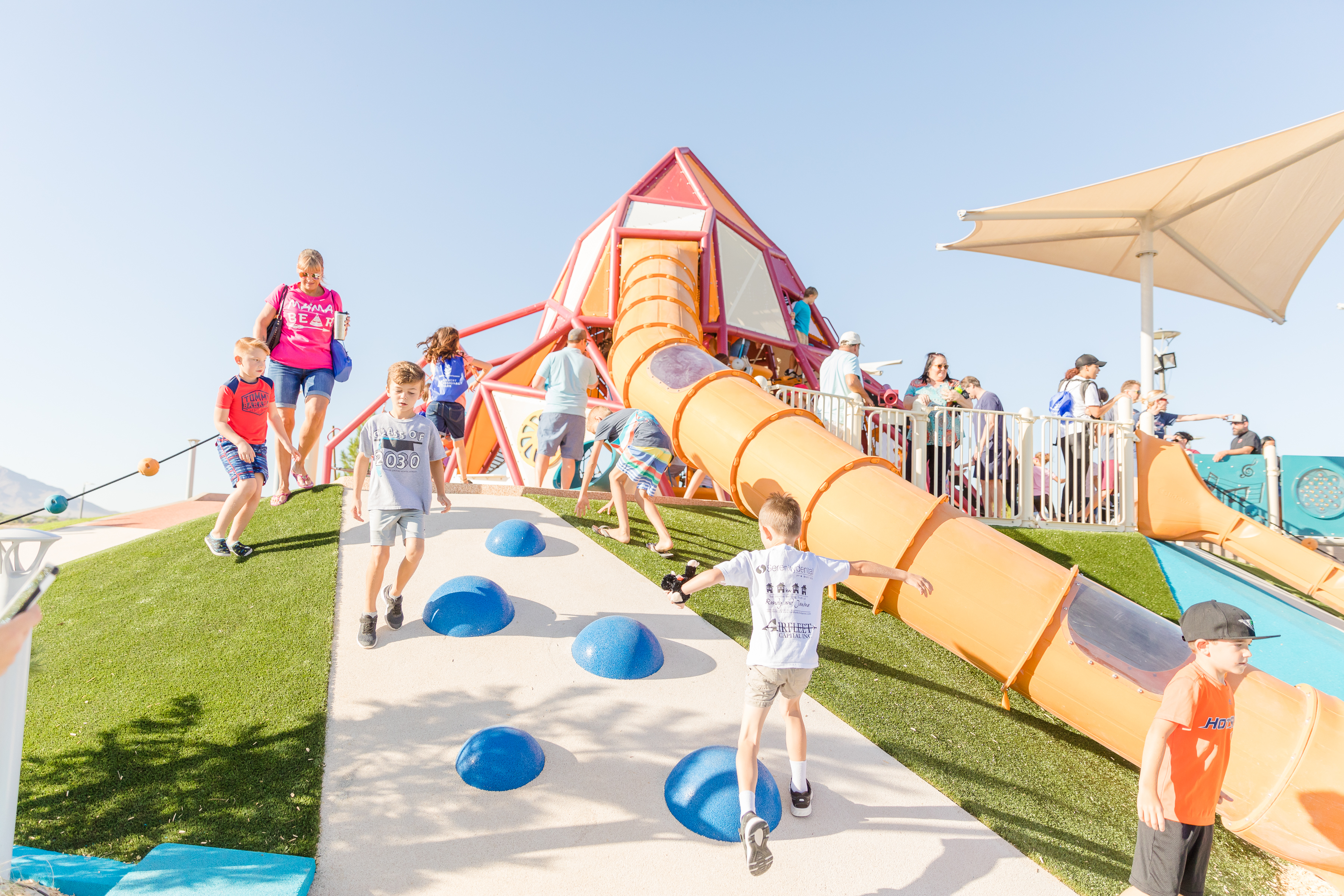 Kids playing on FlexPlay playground mounds