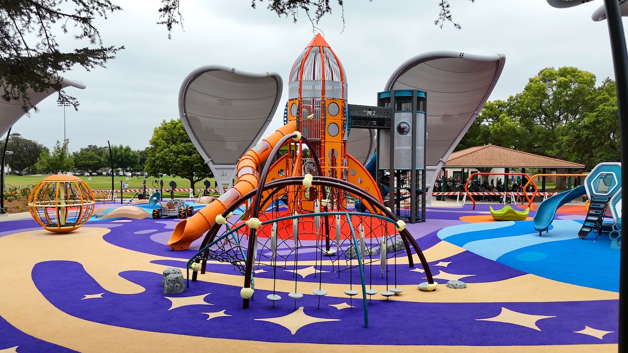 playground equipment atop colorful poured in place surfacing
